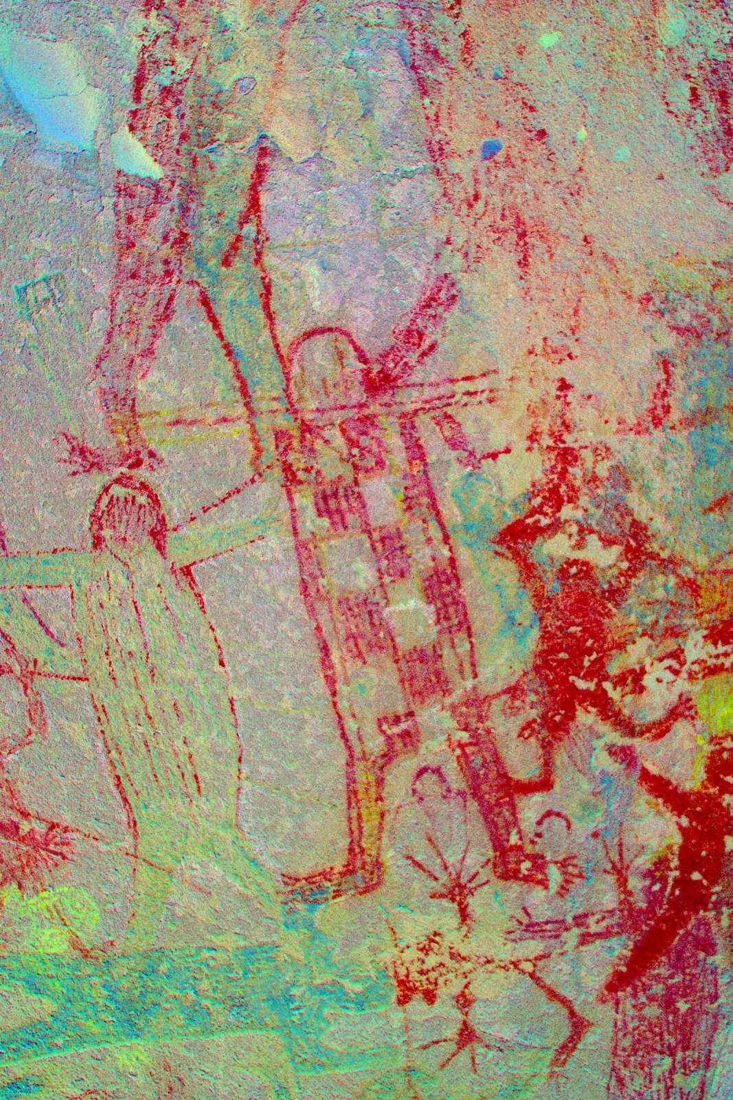 Soneone has tried to erase (by pecking the paint away) the strange small creature ("El Sapo") beneath the scarecrow. The small solid red mono to the right of the scarecrow has one straight and one bent leg. There are several other such monos on the ceiling. (LRE)