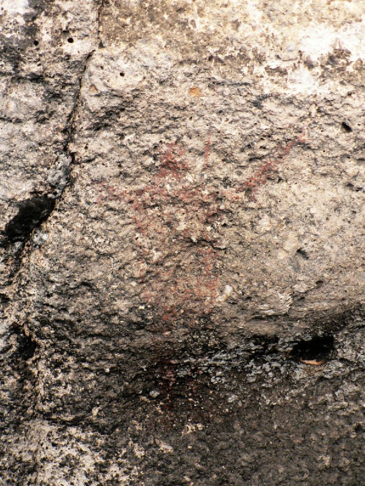 Near Soledad is another cave with faint smudges on its walls.